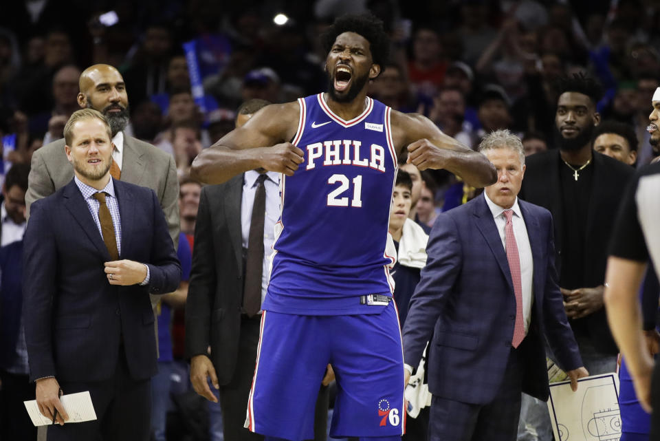 Philadelphia 76ers' Joel Embiid reacts after it was announced that he and Minnesota Timberwolves' Karl-Anthony Towns were ejected, during the second half of an NBA basketball game Wednesday, Oct. 30, 2019, in Philadelphia. The 76ers won 117-95. (AP Photo/Matt Rourke)