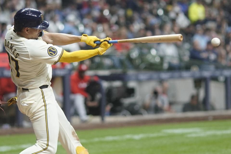 Milwaukee Brewers' Willy Adames hits a double during the seventh inning of a baseball game against the St. Louis Cardinals Friday, May 10, 2024, in Milwaukee. (AP Photo/Morry Gash)