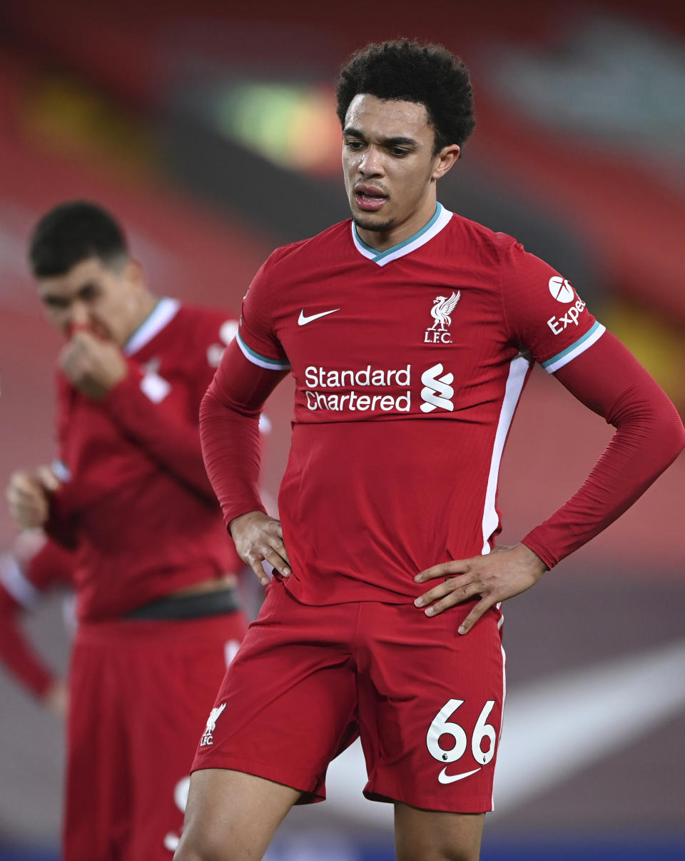 Liverpool's Trent Alexander-Arnold reacts after the end of the English Premier League soccer match between Liverpool and Everton at Anfield in Liverpool, England, Saturday, Feb. 20, 2021. Everton won the game 2-0. (Lawrence Griffiths/ Pool via AP)