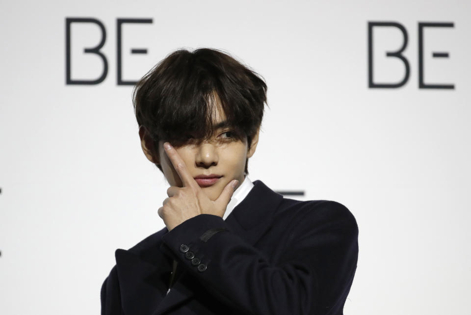 FILE - V, a member of South Korean K-pop band BTS poses for photographers during a press conference to introduce their new album "BE" in Seoul, South Korea on Nov. 20, 2020. Singers RM and V of the K-pop band BTS began their mandatory military duties under South Korean law, their management agency announced Monday, Dec. 11, 2023. This came a day before two of their bandmates, Jimin and Jung Kook, were also expected to report for duty. (AP Photo/Lee Jin-man, File)