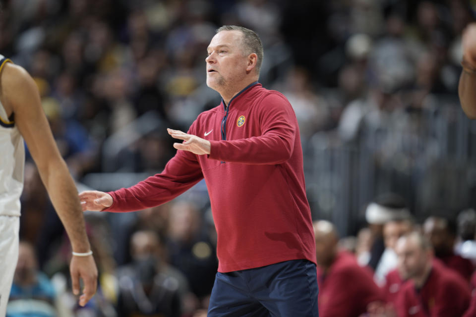 Denver Nuggets head coach Michael Malone directs his players against the Orlando Magic in the first half of an NBA basketball game Sunday, Jan. 15, 2023, in Denver. (AP Photo/David Zalubowski)