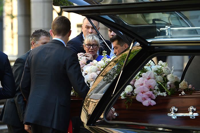 Pallbearers pay their respects after carrying the casket during the funeral service for Rebecca Wilson, at St Andrews Cathedral. Photo: AAP