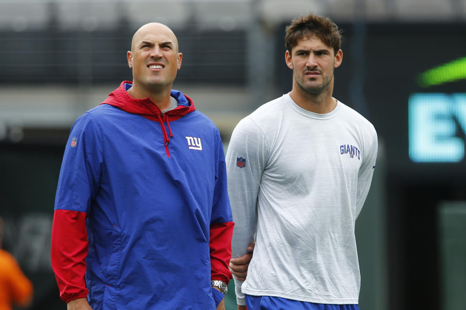 FILE - New York Giants offensive coordinator Mike Kafka, left, and quarterback Daniel Jones (8) watch practices before a preseason NFL football game against the New York Jets, Aug. 28, 2022, in East Rutherford, N.J. The Carolina Panthers have requested permission to interview four different NFL offensive coordinators for their head coaching vacancy, including Kafka, Philadelphia’s Shane Steichen, Buffalo’s Ken Dorsey and Detroit’s Ben Johnson, according to a person familiar with the situation. (AP Photo/John Munson, File)