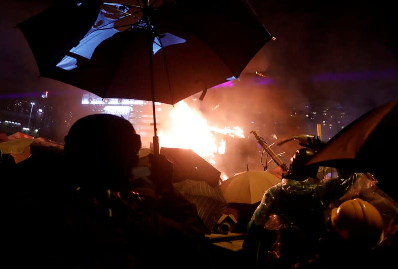 Protesters clash with police outside Hong Kong Polytechnic University (PolyU) in Hong Kong