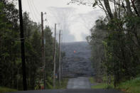 The Kilauea lava flow cuts off Kahukai Street, in the Leilani Estates near Pahoa, Hawaii. REUTERS/Marco Garcia