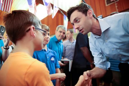 Democratic candidate Jon Ossoff greets Ernest Gephardt while campaigning for Georgia's 6th Congressional District special election in Sandy Springs, Georgia, U.S., June 19, 2017. REUTERS/Chris Aluka Berry