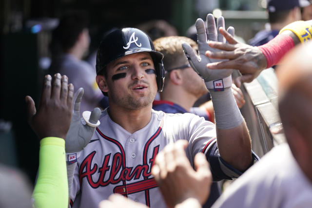 Braves' Orlando Arcia exits after being hit on the wrist with fastball