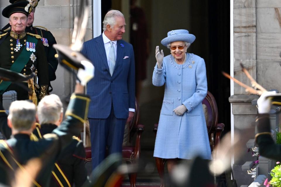 Prince Charles, Prince of Wales and Queen Elizabeth II attend the Royal Company of Archers Reddendo Parade in the gardens of the Palace of Holyroodhouse