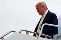 U.S. President Donald Trump descends from Air Force One at Orlando Sanford International Airport in Sanford, Florida