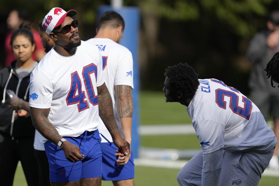 Buffalo Bills linebacker Von Miller (40) speaks with Buffalo Bills cornerback Kaiir Elam (24) during a practice session in Watford, Hertfordshire, England, north-west of London, Friday, Oct. 6, 2023. The Buffalo Bills will take on the Jacksonville Jaguars in a regular season game at Tottenham Hotspur Stadium on Sunday. (AP Photo/Steve Luciano)