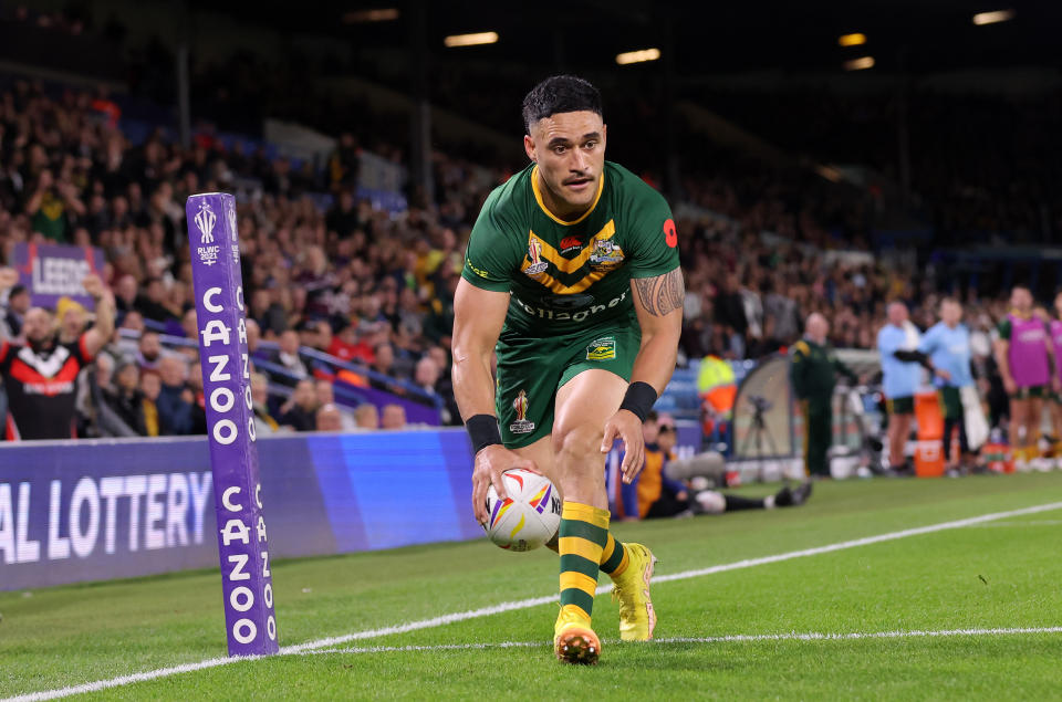 Valentine Holmes (pictured) puts the ball down for a try.