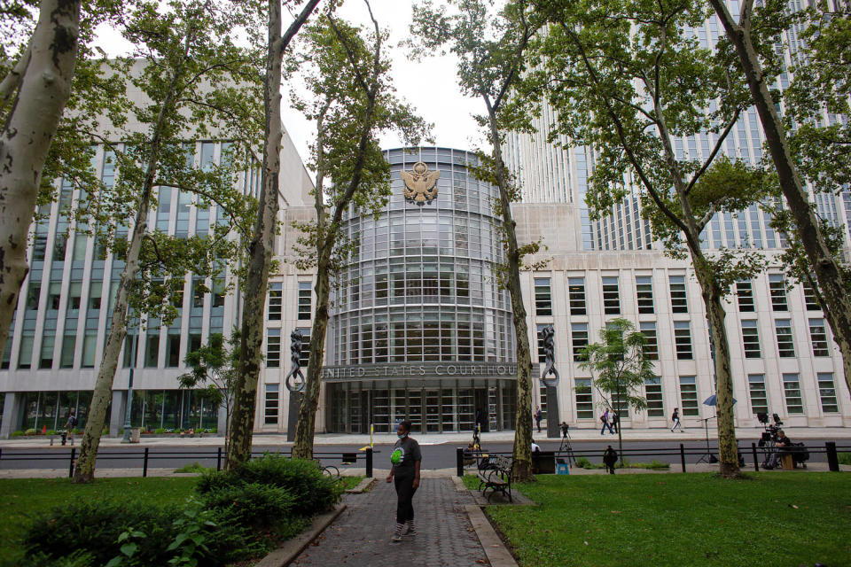 A woman stands near the Brooklyn federal court. (Kena Betancur  / AFP via Getty Images file)