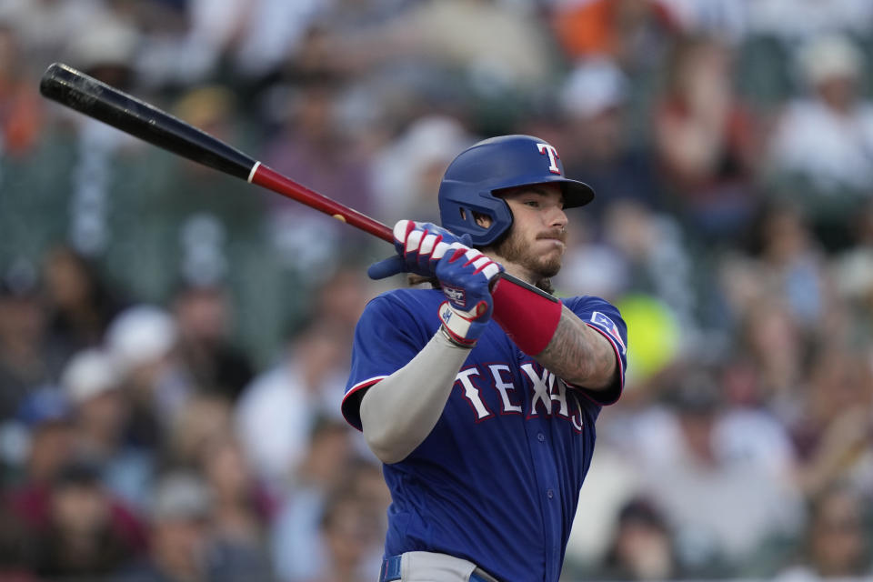 Texas Rangers' Jonah Heim watches his two-RBI single to right field during the fifth inning of a baseball game against the Detroit Tigers, Tuesday, May 30, 2023, in Detroit. (AP Photo/Carlos Osorio)