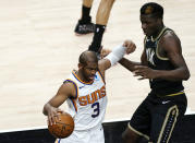 Phoenix Suns guard Chris Paul (3) works his way past Atlanta Hawks center Clint Capela (15) in the first half of an NBA basketball game Wednesday, May 5, 2021, in Atlanta. (AP Photo/John Bazemore)