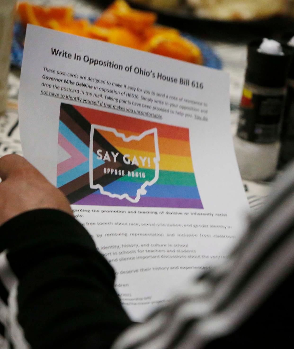 Literature is passed out at the dinner table at the Bayard Rustin LGBTQ Resource Center on how to oppose Ohio House Bill 616 in Akron.