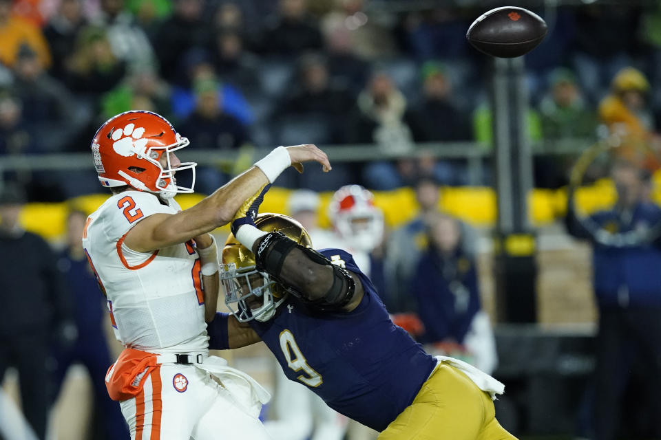 Notre Dame defensive lineman Justin Ademilola pressures Clemson quarterback Cade Klubnik into throwing an interception during the second half of an NCAA college football game Saturday, Nov. 5, 2022, in South Bend, Ind. Notre Dame won 35-14. (AP Photo/Charles Rex Arbogast)