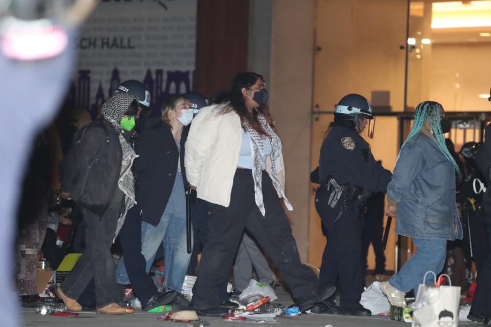 Cops in riot gear cuffed the protesters, who are demanding NYU divest from holdings tied to Israel over the ongoing violence in Gaza. William C Lopez/New York Post