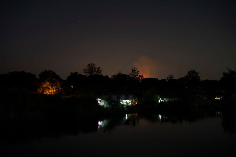 Myanmar refugees settle temporarily on the Moei River Bank, in Mae Sot