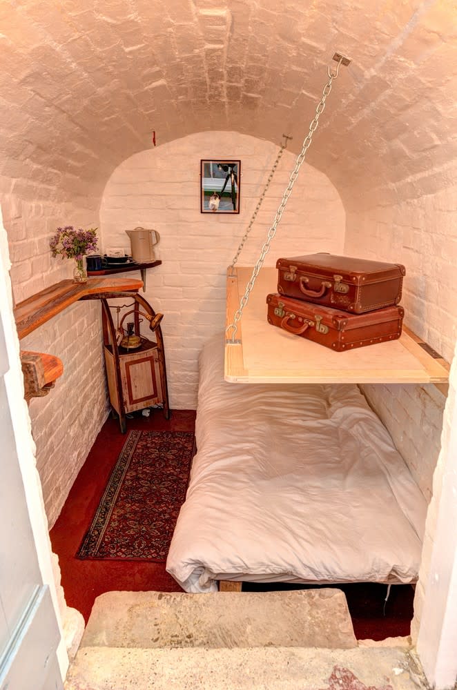 <p><span>You don’t have to break the law to sleep in prison – </span><a rel="nofollow noopener" href="http://hostunusual.co.uk/categories/glamping/penny-rope-bed-chamber/" target="_blank" data-ylk="slk:this cell in Margate" class="link "><span>this cell in Margate</span></a><span> has been lovingly converted into a quirky bedroom complete with a bunk bed, hot water bottles and rustic tin mugs. The room, which sleeps two and is attached to a Georgian house, starts at £75 per night and is ideally located for exploring this seaside town. [Photo: Host Unusual]</span> </p>