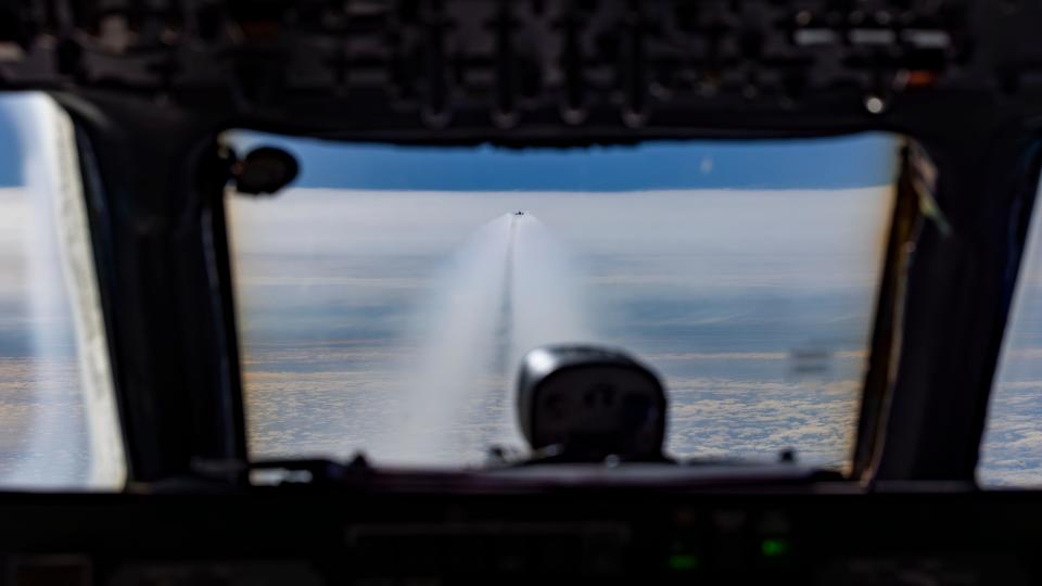 Contrails produced by Boeing's 737 MAX 10 ecoDemonstrator are visible from the NASA DC-8 Airborne Science Lab's flight deck during a test flight over Montana.