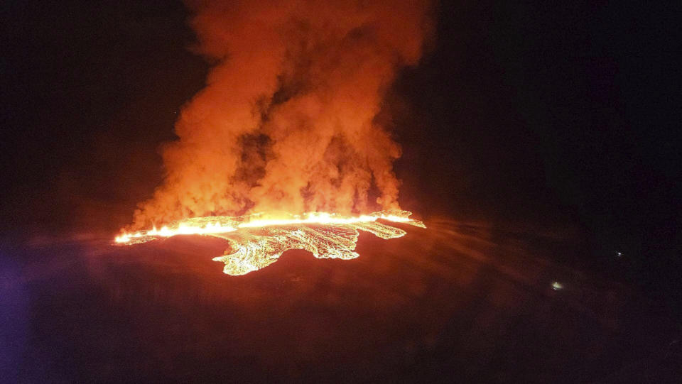 In this photo provided by Civil Protection taken from the Coast Guard's helicopter, a view of lava as the volcano erupts near Grindavík, Iceland, Sunday, Jan. 14. 2024. A volcano has erupted in southwestern Iceland, sending semi-molten rock spewing toward a nearby settlement for the second time in less than a month. Iceland's Icelandic Meteorological Office says the eruption Sunday came after a swarm of earthquakes near the town of Grindavik. (Icelandic Civil Protection via AP)