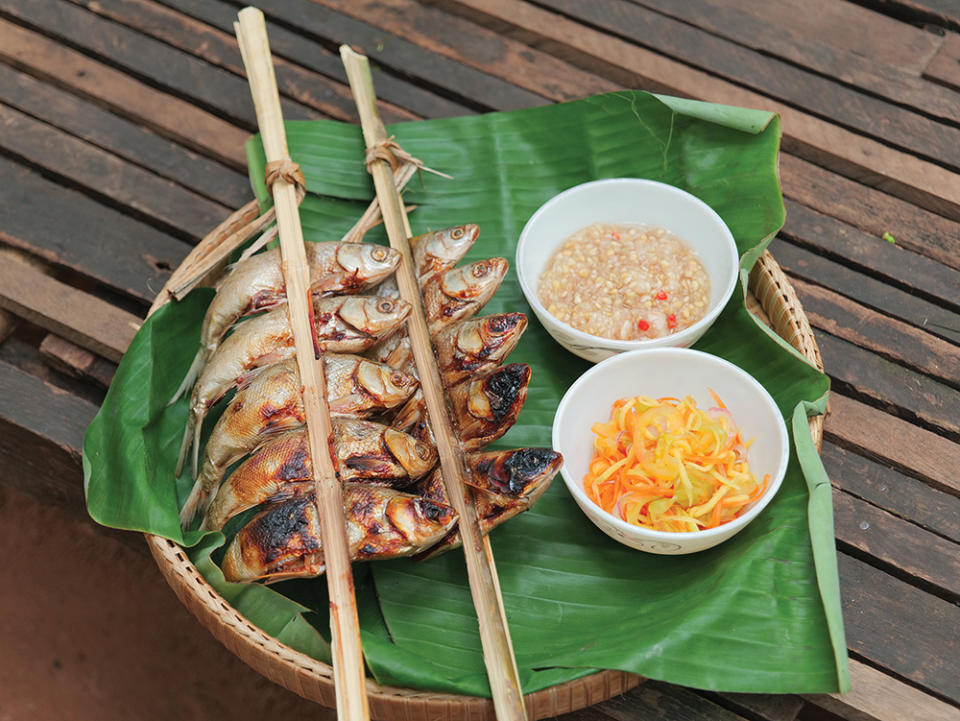 A meal of grilled fish and mango salad cooked by villagers in Siem Reap