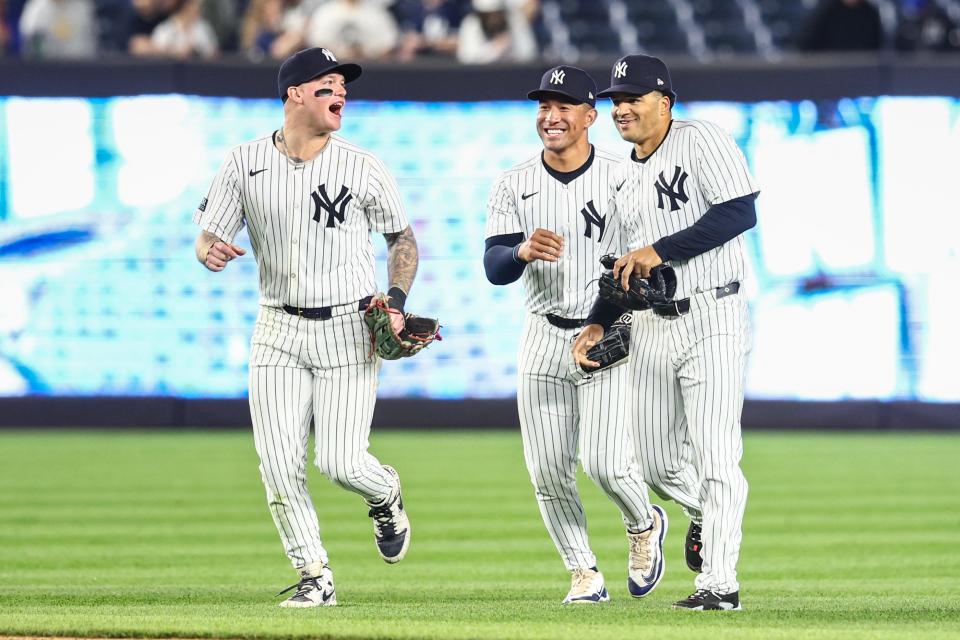 May 7, 2024; Bronx, New York, USA; New York Yankees left fielder Alex Verdugo (24), center fielder Trent Grisham (12) and right fielder Jahmai Jones (14) celebrate after defeating the Houston Astros at Yankee Stadium. Mandatory Credit: Wendell Cruz-USA TODAY Sports