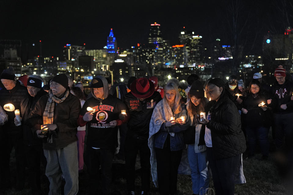 FILE - People attend a candlelight vigil for victims of a shooting at a Kansas City Chiefs Super Bowl victory rally, Thursday, Feb. 15, 2024, in Kansas City, Mo. Missouri prosecutors said Tuesday, Feb. 20, that two men have been charged with murder in last week’s shooting that killed one person and injured multiple others after the Kansas City Chiefs’ Super Bowl parade. (AP Photo/Charlie Riedel, File)