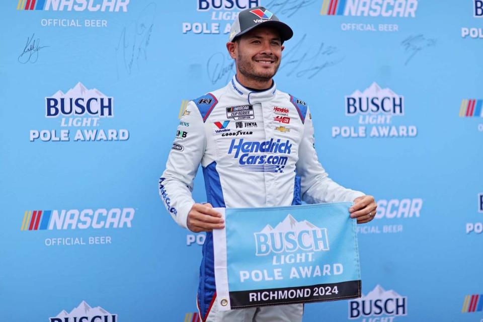 Mar 30, 2024; Richmond, Virginia, USA; NASCAR Cup Series driver Kyle Larson (5) celebrates winning the pole after qualifying for the Toyota Owners 400 at Richmond Raceway.