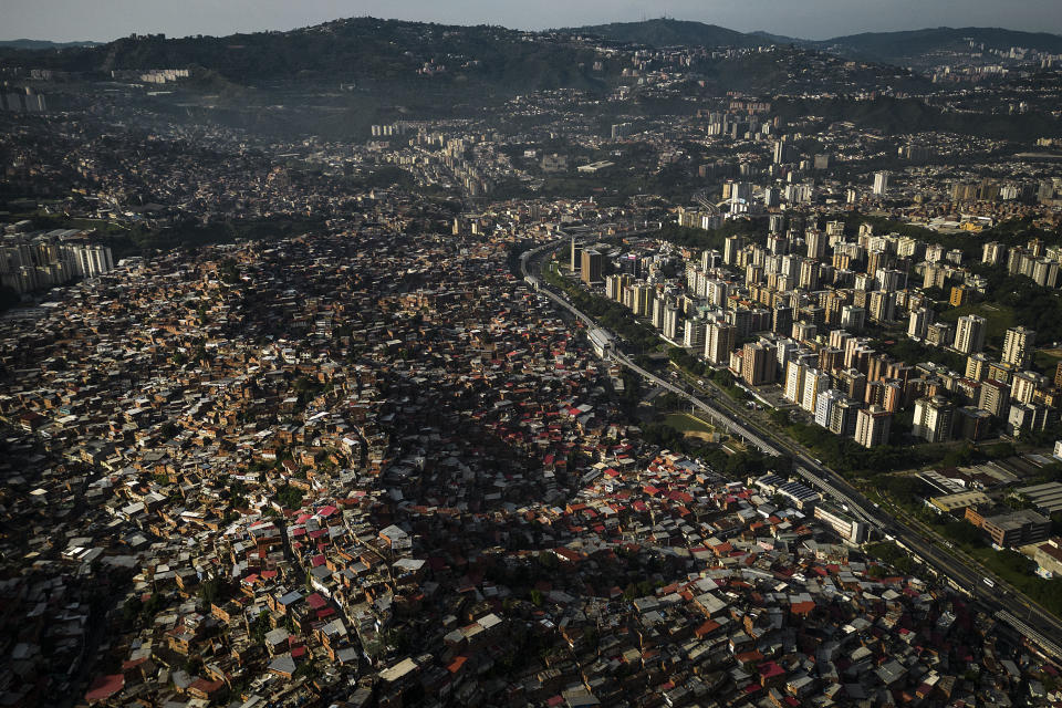 Homes cover a hill in the Petare neighborhood of Caracas, Venezuela, Monday, Oct. 2, 2023. (AP Photo/Matias Delacroix)