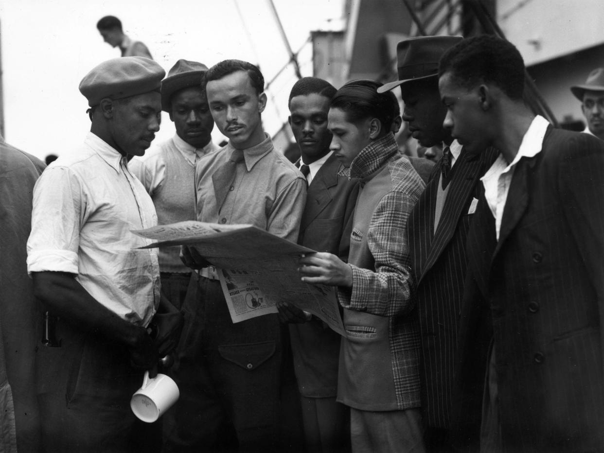 <p>Jamaican men on board the Empire Windrush in 1948</p> (Getty)