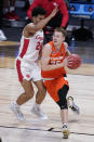 Syracuse guard Buddy Boeheim (35) drives against Houston guard Quentin Grimes (24) in the first half of a Sweet 16 game in the NCAA men's college basketball tournament at Hinkle Fieldhouse in Indianapolis, Saturday, March 27, 2021. (AP Photo/Michael Conroy)