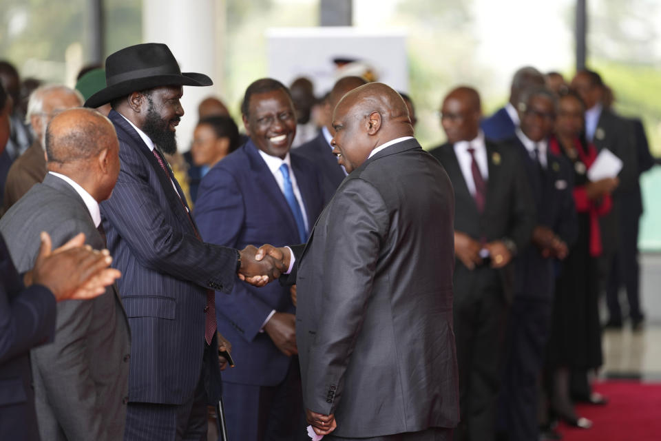 South Sudanese President Salva Kiir Mayardit, left, shakes hands with Pagan Amum Okiech, leader of the Real-SPLM group, during the launch of high-level peace talks for South Sudan at State House in Nairobi, Kenya, on Thursday, May 9, 2024. High-level mediation talks on South Sudan were launched in Kenya with African presidents in attendance calling for an end to a conflict that has crippled the country's economy for years. (AP Photo/Brian Inganga)
