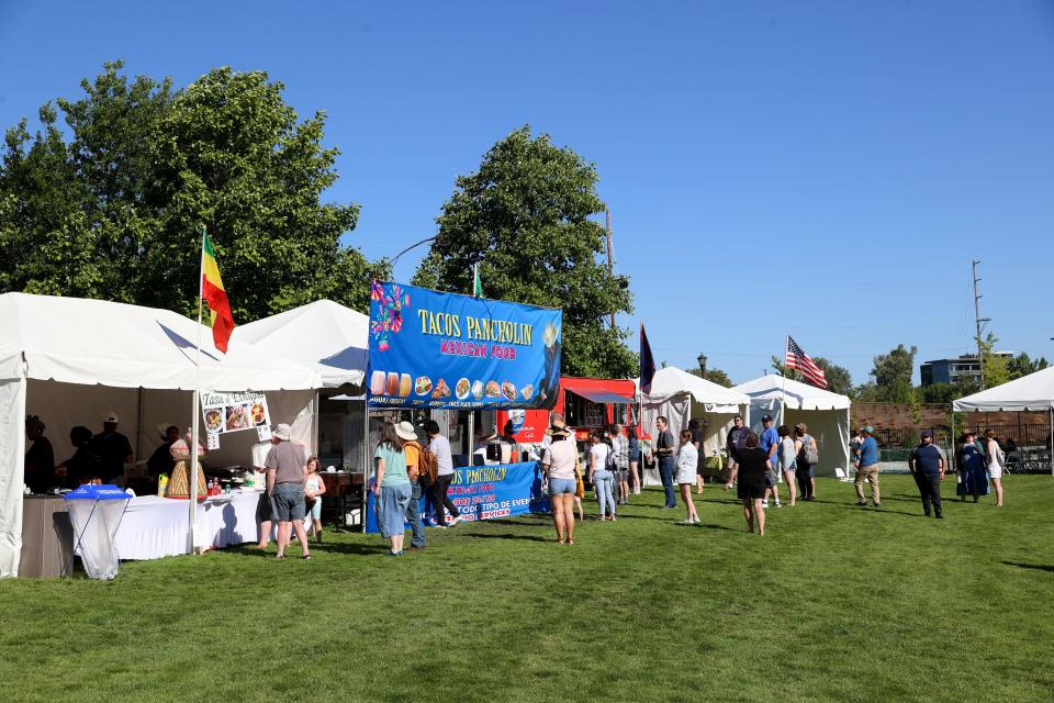 People line up for food vendors during the World Beat Festival at Riverfront Park in Salem on Friday, June 24, 2022.