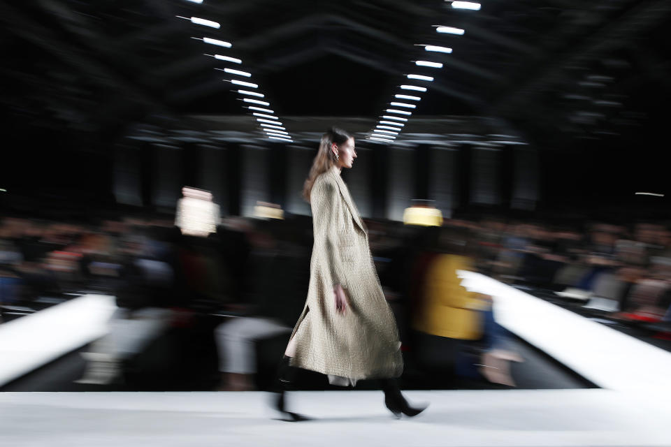 A model wears a creation as part of the Ermanno Scervino women's Fall Winter 2020-21 collection, unveiled during the Fashion Week in Milan, Italy, Saturday, Feb. 22, 2020. (AP Photo/Antonio Calanni)