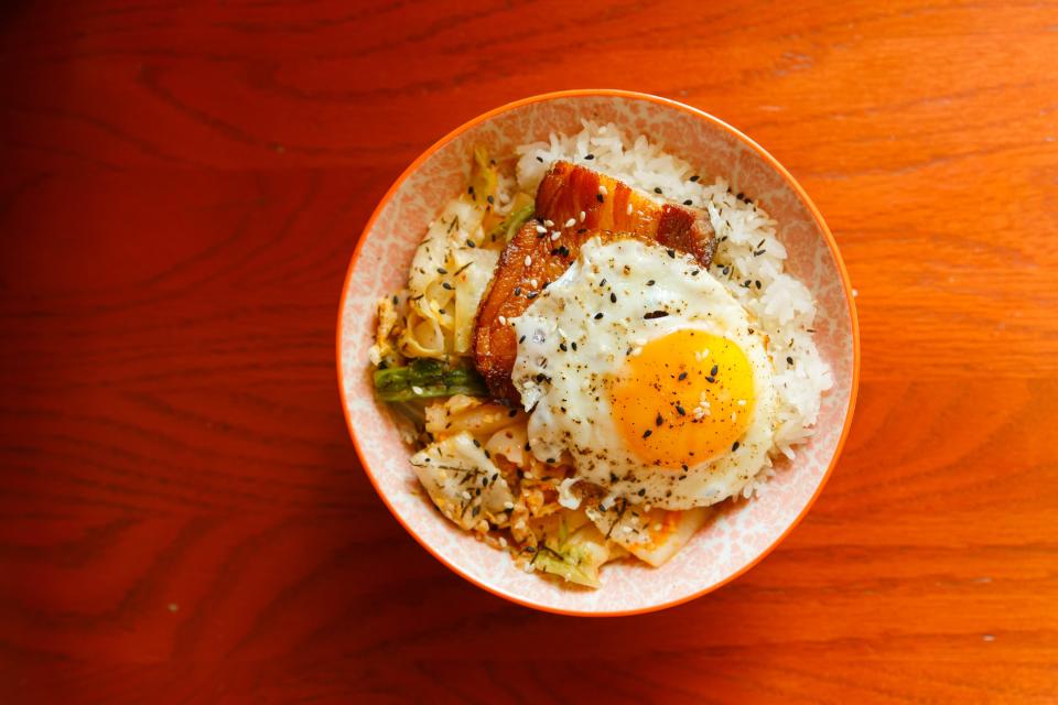 Landing House’s kimchi and steamed rice with pork belly.