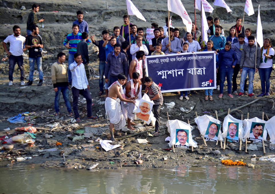 Activists from SFI perform a mock funeral of India’s PM Modi