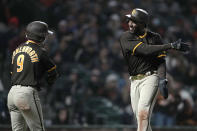 San Diego Padres' Jake Cronenworth (9) celebrates with Jurickson Profar, right, after scoring against the San Francisco Giants on a double by Wil Myers during the eighth inning of a baseball game in San Francisco, Friday, May 20, 2022. (AP Photo/Tony Avelar)