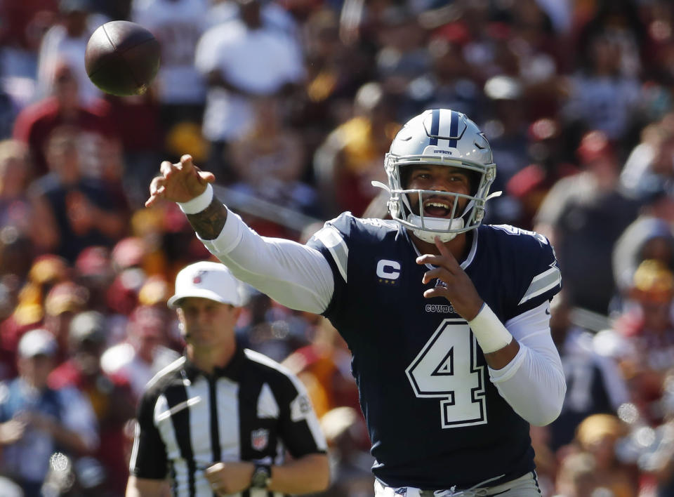 Dallas Cowboys quarterback Dak Prescott (4) passes downfield during the second half of an NFL football game, Sunday, Sept. 15, 2019, in Landover, Md. (AP Photo/Alex Brandon)