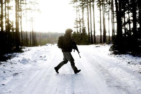 An Estonian army conscript soldier attends a tactical training in the military training field near Tapa, Estonia February 16, 2017. Picture taken February 16, 2017. REUTERS/Ints Kalnins