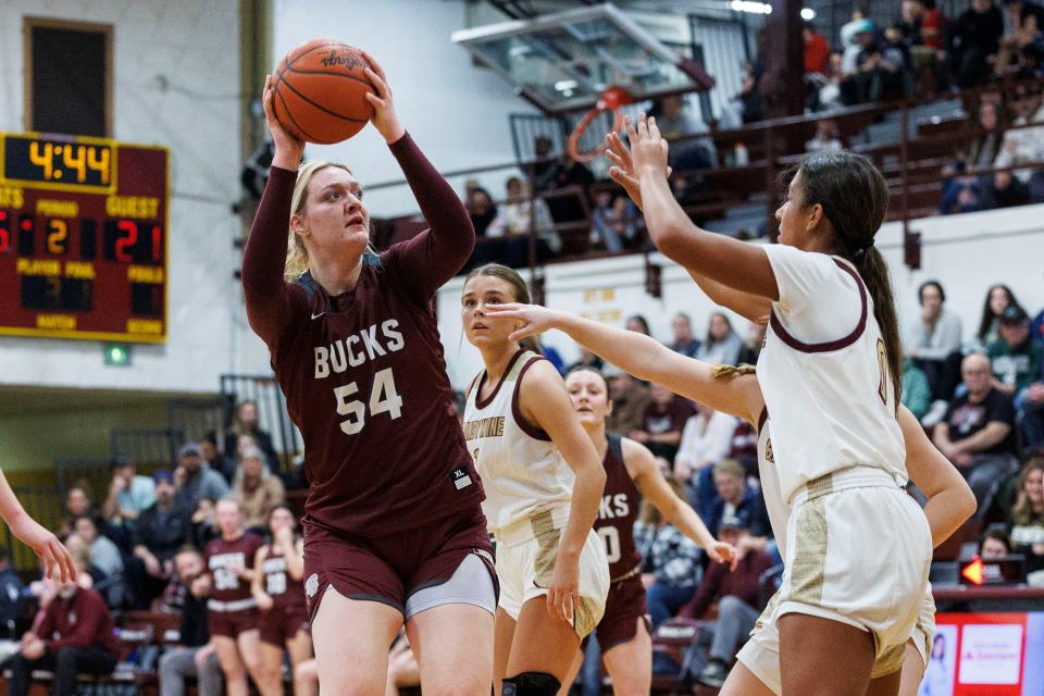 Buchanan's Faith Carson (54) goes up for a shot as Brandywine's Adeline Gill (0) defends during the Buchanan-Brandywine high school basketball game on Thursday, February 02, 2023, at Brandywine High School in Niles, Michigan.