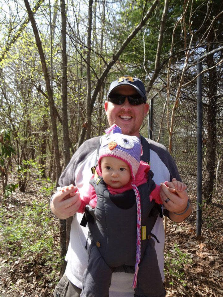 This April 2013 photo provided by Jeremy Foster of Kansas City, Mo., shows Foster, 37, with his daughter Sophia, who turns 1 on June 12, at the Kansas City Zoo. Foster is an example of a new generation of fathers who don’t just change the occasional diaper but who, as he puts it, have “made a conscious decision to share in all the responsibilities in a way that’s equal” with their wives when it comes to childrearing. (AP Photo/Jeremy Foster)