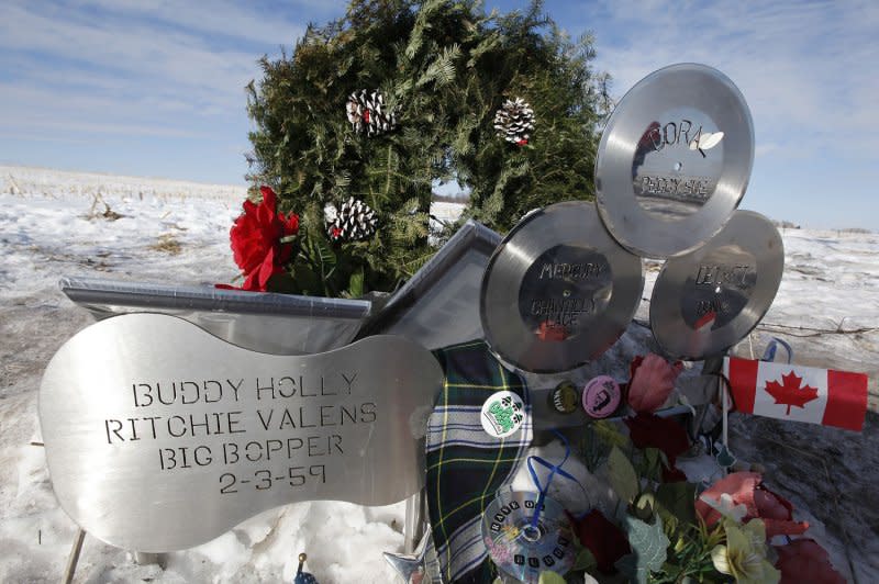 Flowers and tributes are left 50 years later at the site of the plane crash that killed Buddy Holly, Ritchie Valens and J. P. "The Big Bopper" Richardson near Clear Lake, Iowa, on February 2, 1959. File Photo by Brian Kersey/UPI