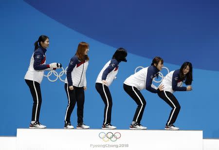 Medals Ceremony - Short Track Speed Skating Events - Pyeongchang 2018 Winter Olympics - Women's 3000 m - Medals Plaza - Pyeongchang, South Korea - February 21, 2018 - Gold medalists Shim Sukhee, Minjeong Choi, Kim Alang and Kim Yejin of South Korea on the podium. REUTERS/Kim Hong-Ji