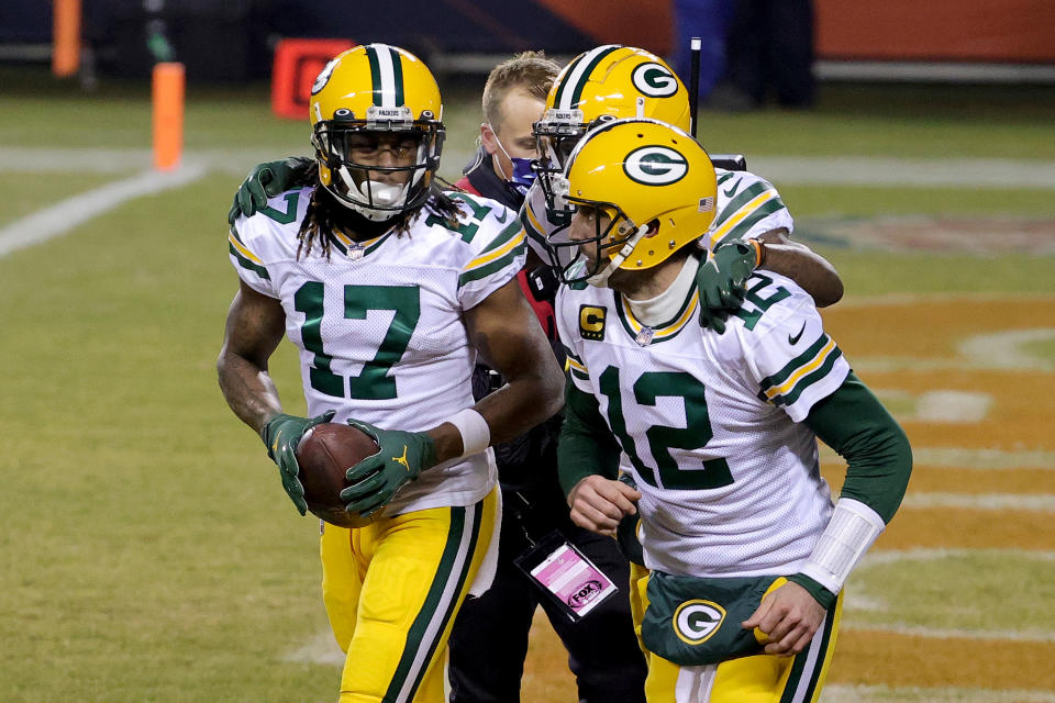 CHICAGO, ILLINOIS - JANUARY 03: Davante Adams #17 of the Green Bay Packers celebrates with Aaron Rodgers #12 after scoring a touchdown against the Chicago Bears during the fourth quarter in the game at Soldier Field on January 03, 2021 in Chicago, Illinois. (Photo by Jonathan Daniel/Getty Images)