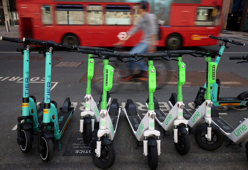 FILE PHOTO: Row of e-scooters from Tier and Lime are seen in Canary Wharf