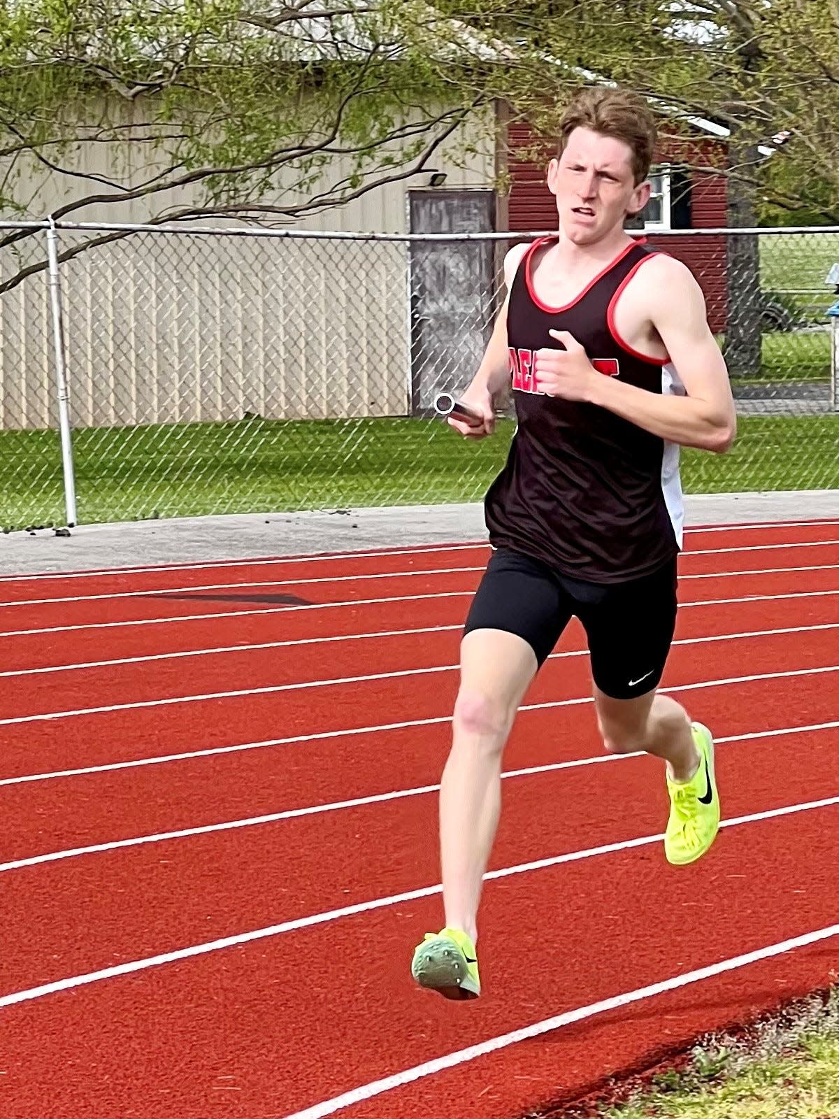 Pleasant's Will Lichtenberger runs a leg of the 4x1600-meter relay during Friday's Elgin Relays.