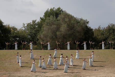 Olympics - Dress Rehearsal - Lighting Ceremony of the Olympic Flame Pyeongchang 2018 - Ancient Olympia, Olympia, Greece - October 23, 2017 Actors perform during the dress rehearsal for the Olympic flame lighting ceremony for the Pyeongchang 2018 Winter Olympic Games at the site of ancient Olympia in Greece REUTERS/Costas Baltas