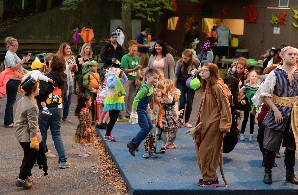 Children and teens dance to music on opening night of Zoo Boo at the Erie Zoo in Erie on Oct. 13.