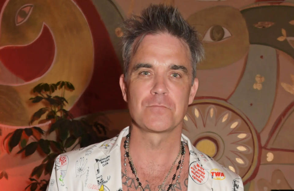 Robbie Williams isn't holding back credit:Bang Showbiz